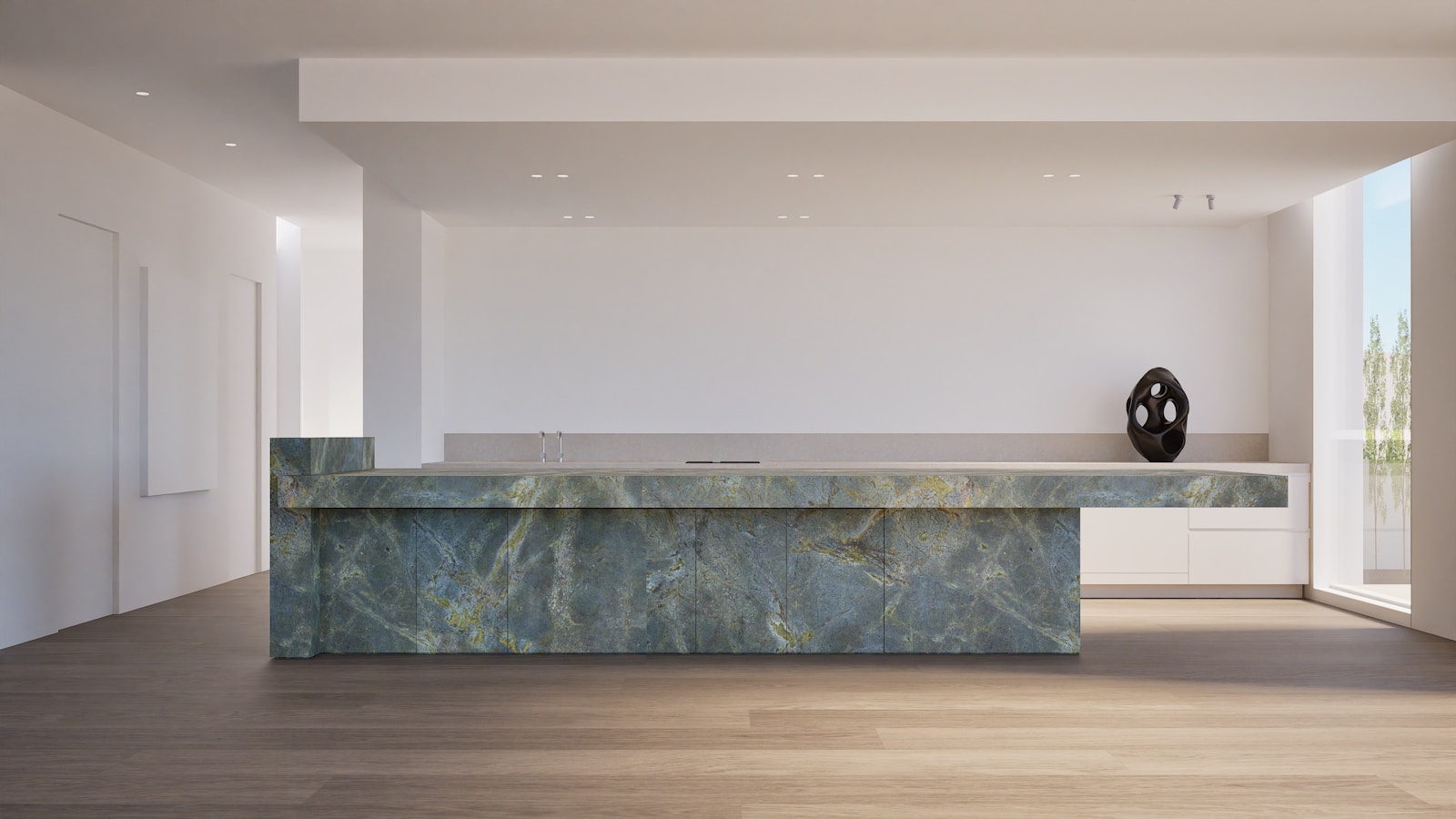 Modern kitchen island with green marble countertop.