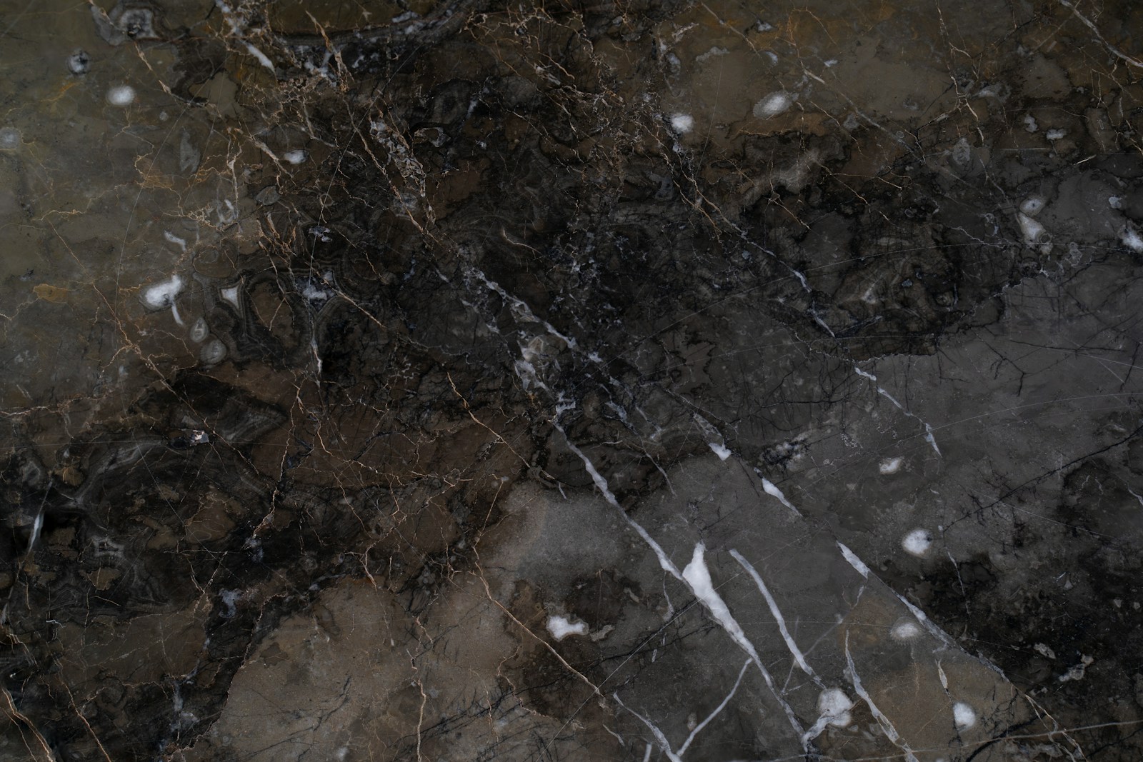 a close up of a marble surface with snow on it